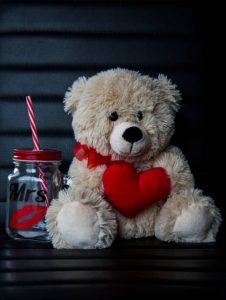 Valentines teddy bear with red heart and jar with kiss. Valentines teddy bear with red heart and jar with kiss.